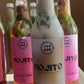 Bottles of Mojito drinks with colorful labels on a white surface.